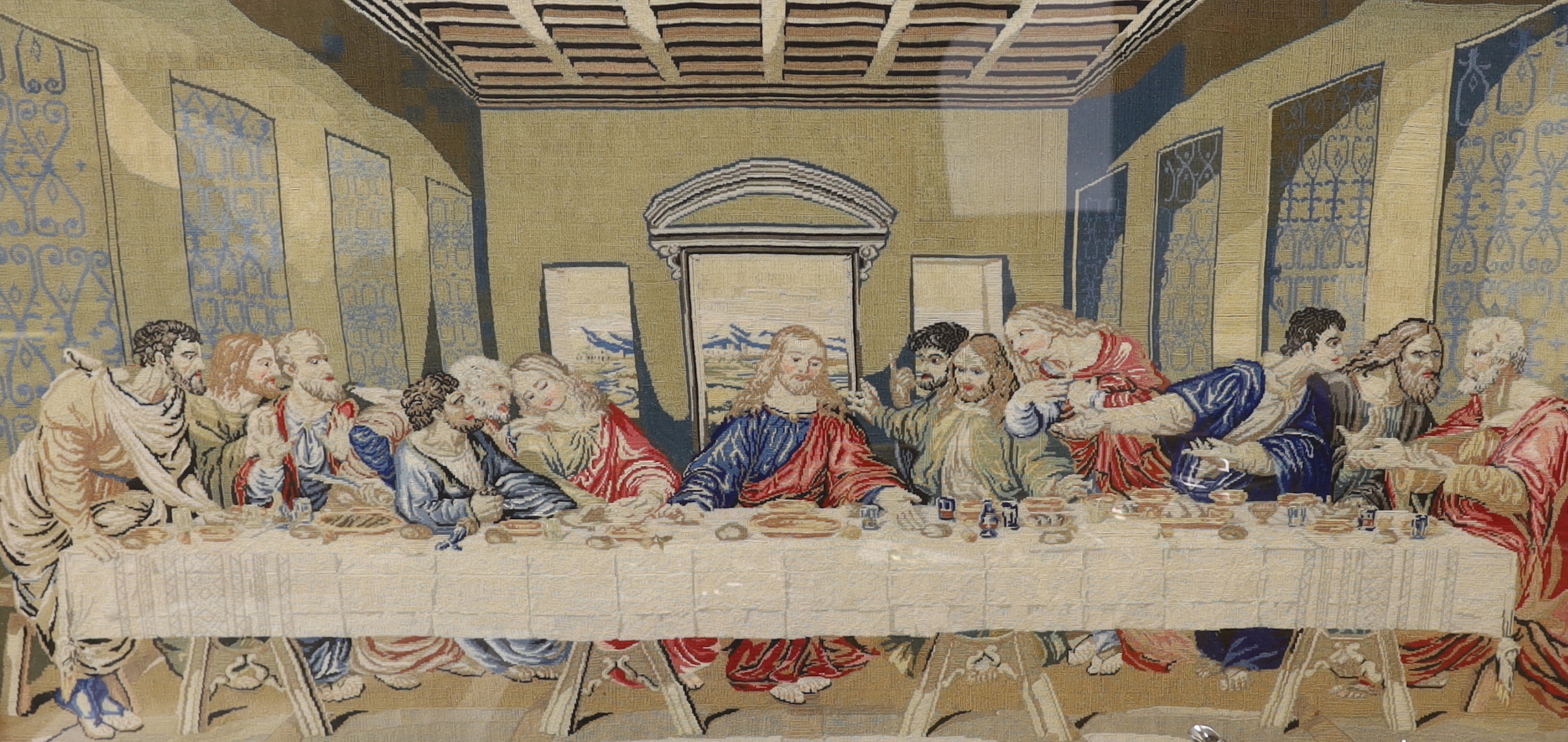 A 20th century fine petit point embroidery of 'The Last Supper', based on Leonardo Da Vinci’s oil painting, 97cm wide, 51cm high